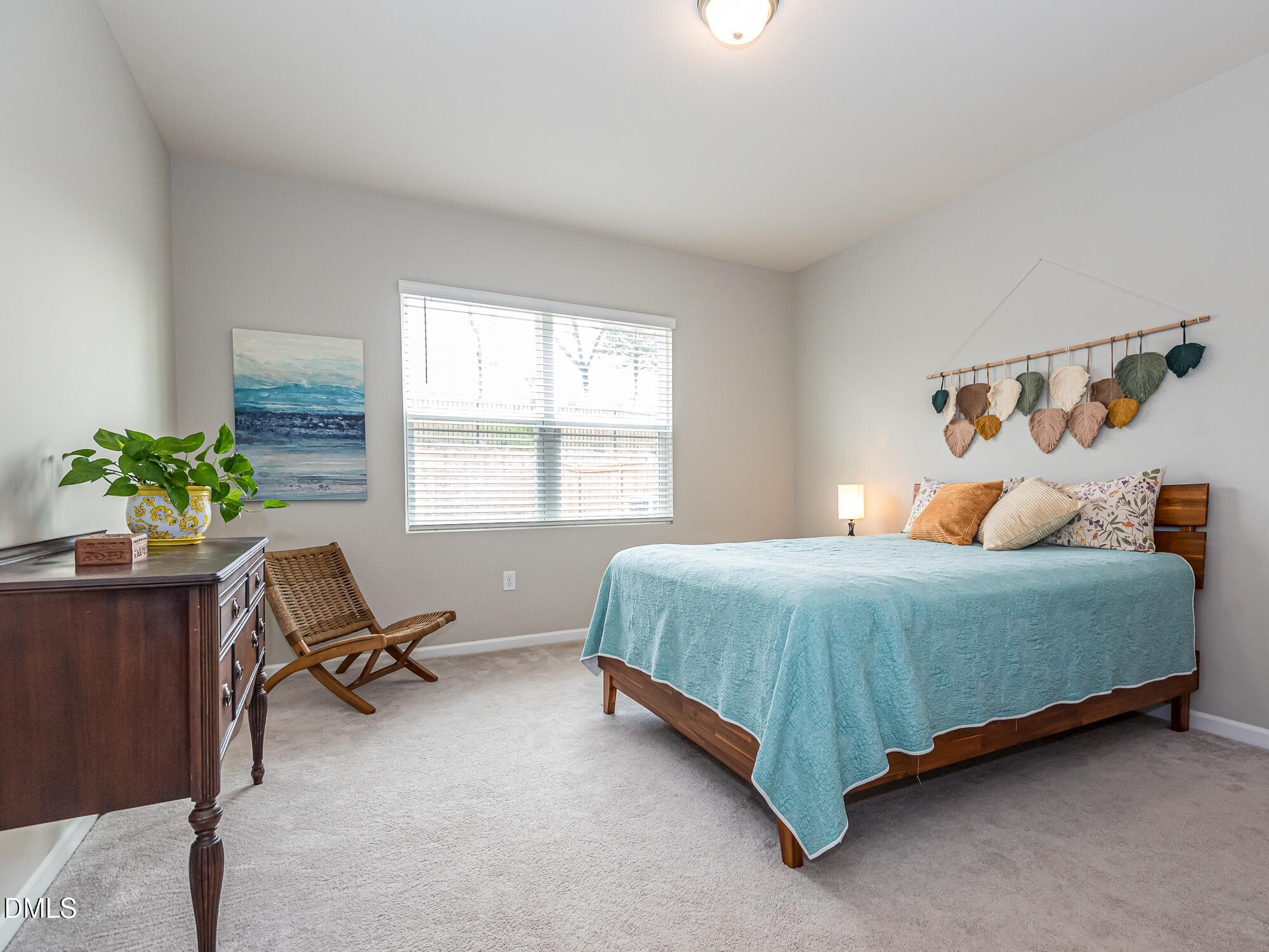 1644 Arapahoe Ridge Drive Raleigh, NC 27604 - Photo 15 of 41 a bedroom with a bed chair and a window
