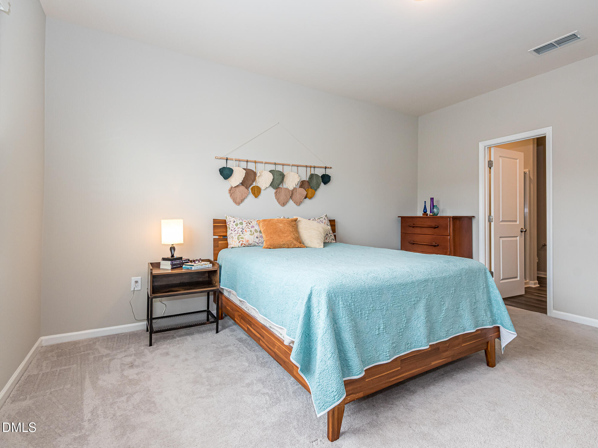 1644 Arapahoe Ridge Drive Raleigh, NC 27604 - Photo 17 of 41 a bedroom with a bed and dresser