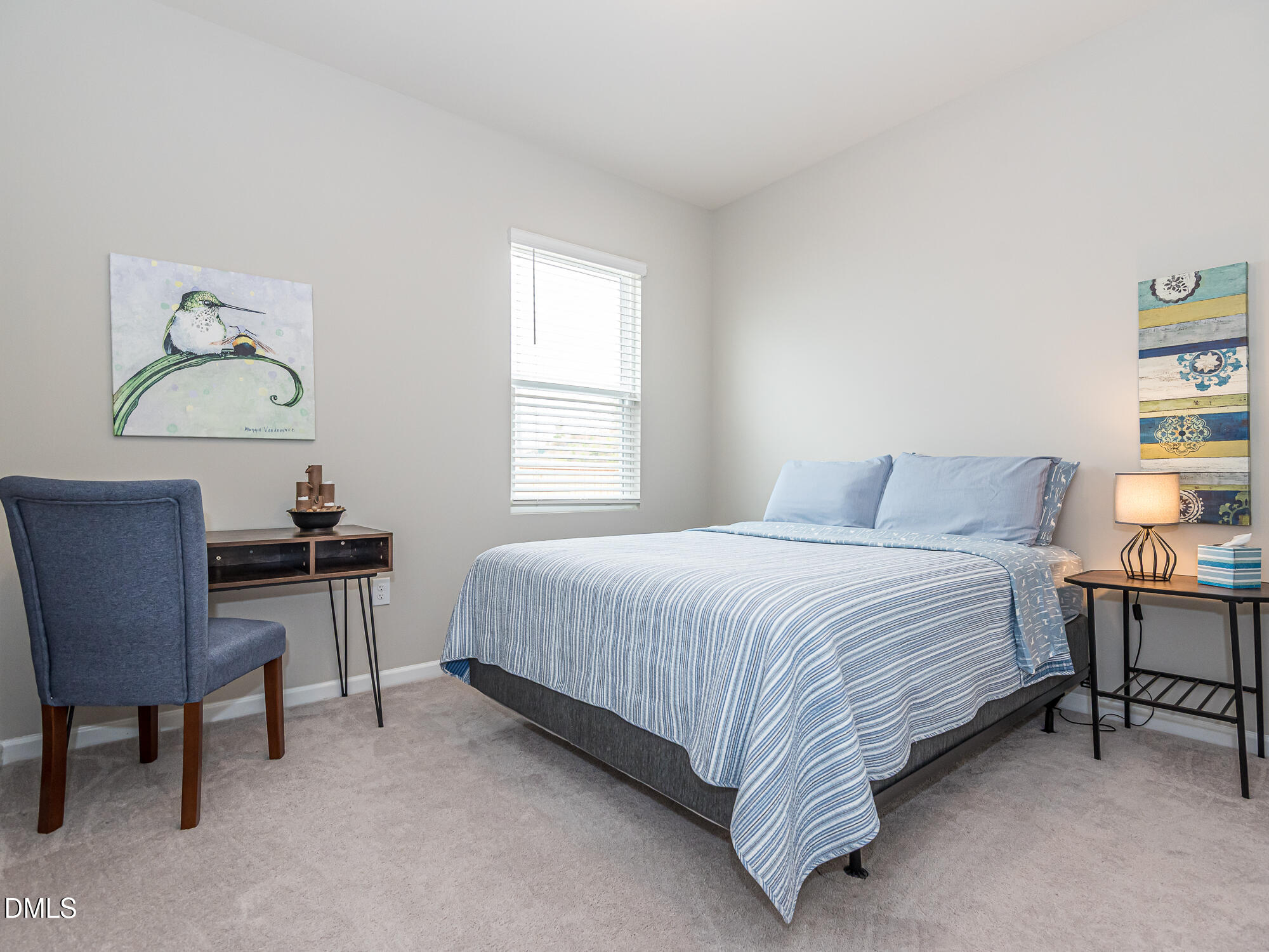 1644 Arapahoe Ridge Drive Raleigh, NC 27604 - Photo 18 of 41 a bedroom with a bed a table and chair