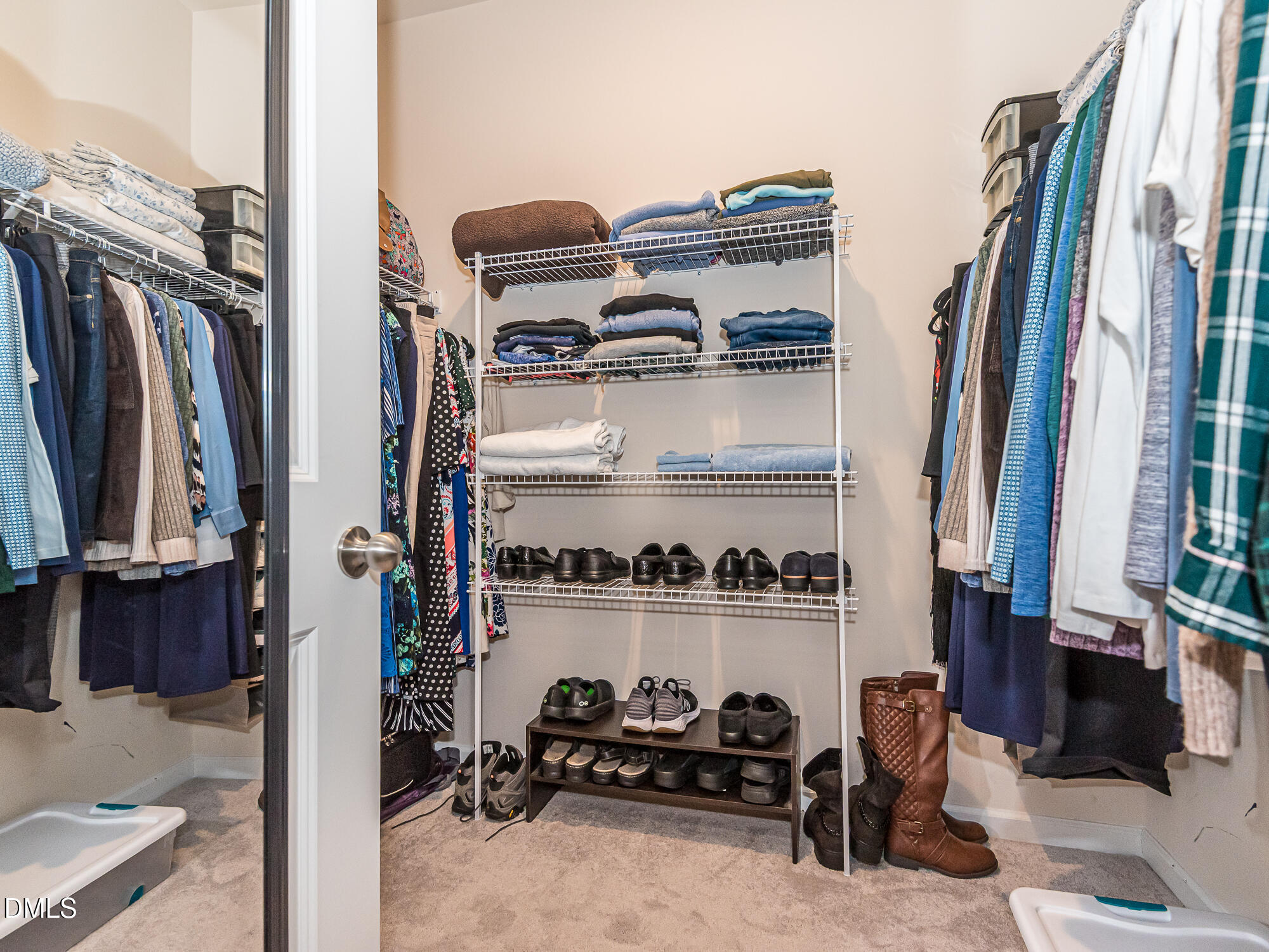1644 Arapahoe Ridge Drive Raleigh, NC 27604 - Photo 19 of 41 a view of walk in closet with clothes and shoes