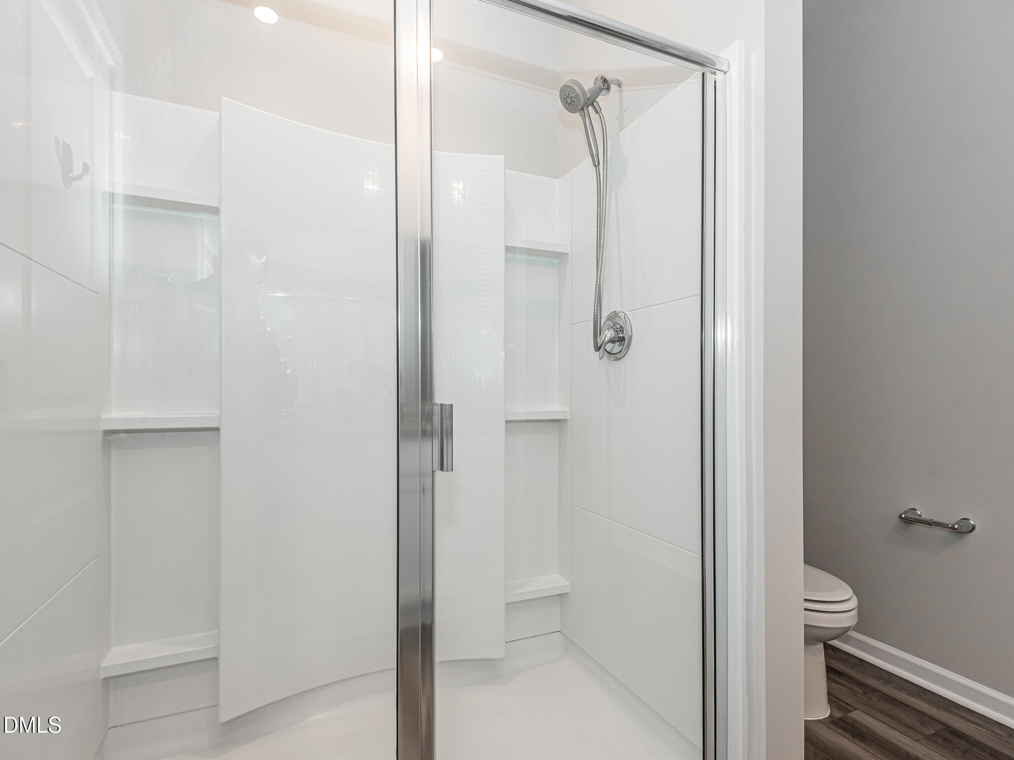 1644 Arapahoe Ridge Drive Raleigh, NC 27604 - Photo 22 of 41 a bathroom with a shower and a toilet