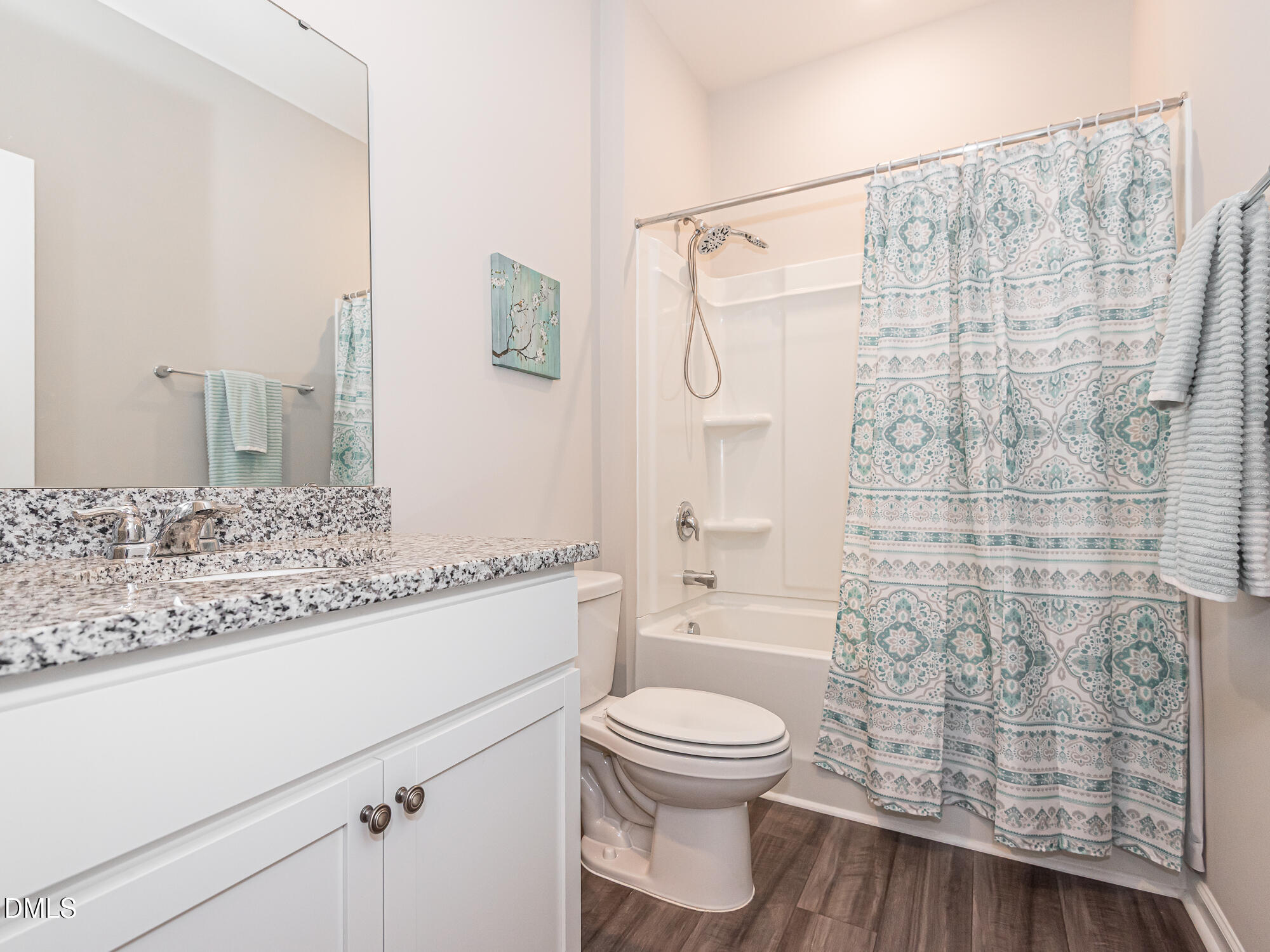 1644 Arapahoe Ridge Drive Raleigh, NC 27604 - Photo 25 of 41 a bathroom with a granite countertop sink a toilet and shower