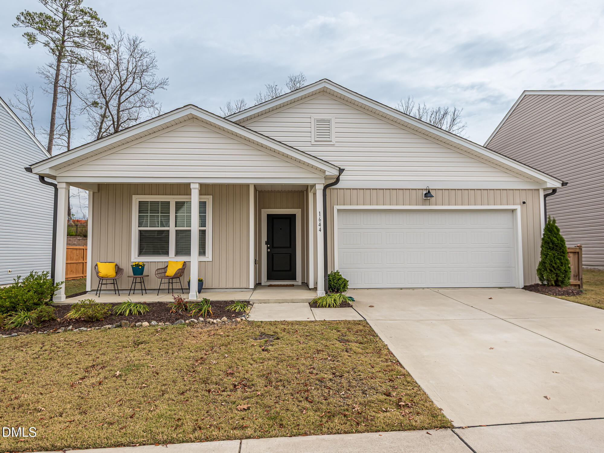 1644 Arapahoe Ridge Drive Raleigh, NC 27604 - Photo 2 of 41 a front view of house with yard and outdoor seating