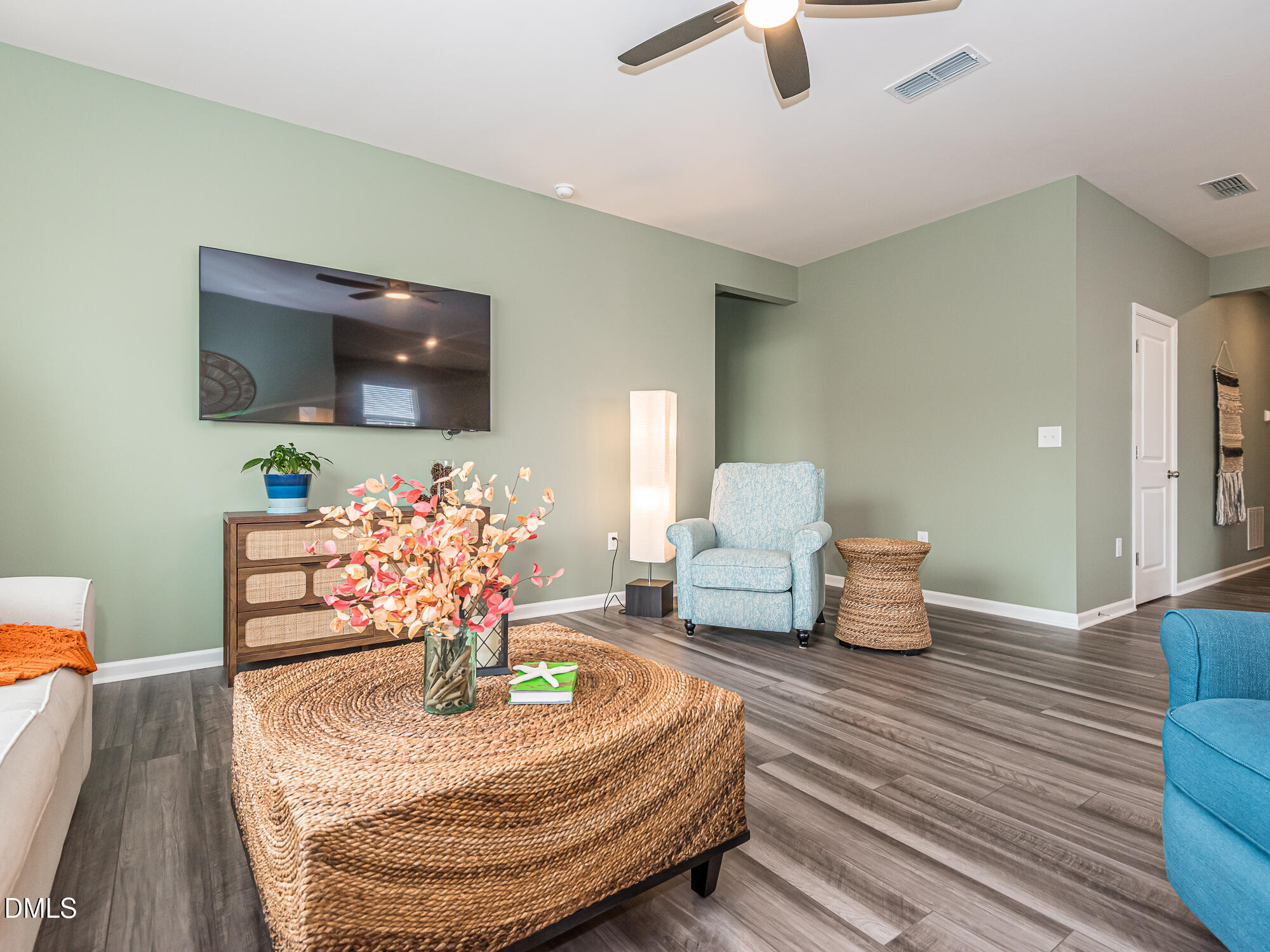 1644 Arapahoe Ridge Drive Raleigh, NC 27604 - Photo 7 of 41 a living room with furniture and a flat screen tv