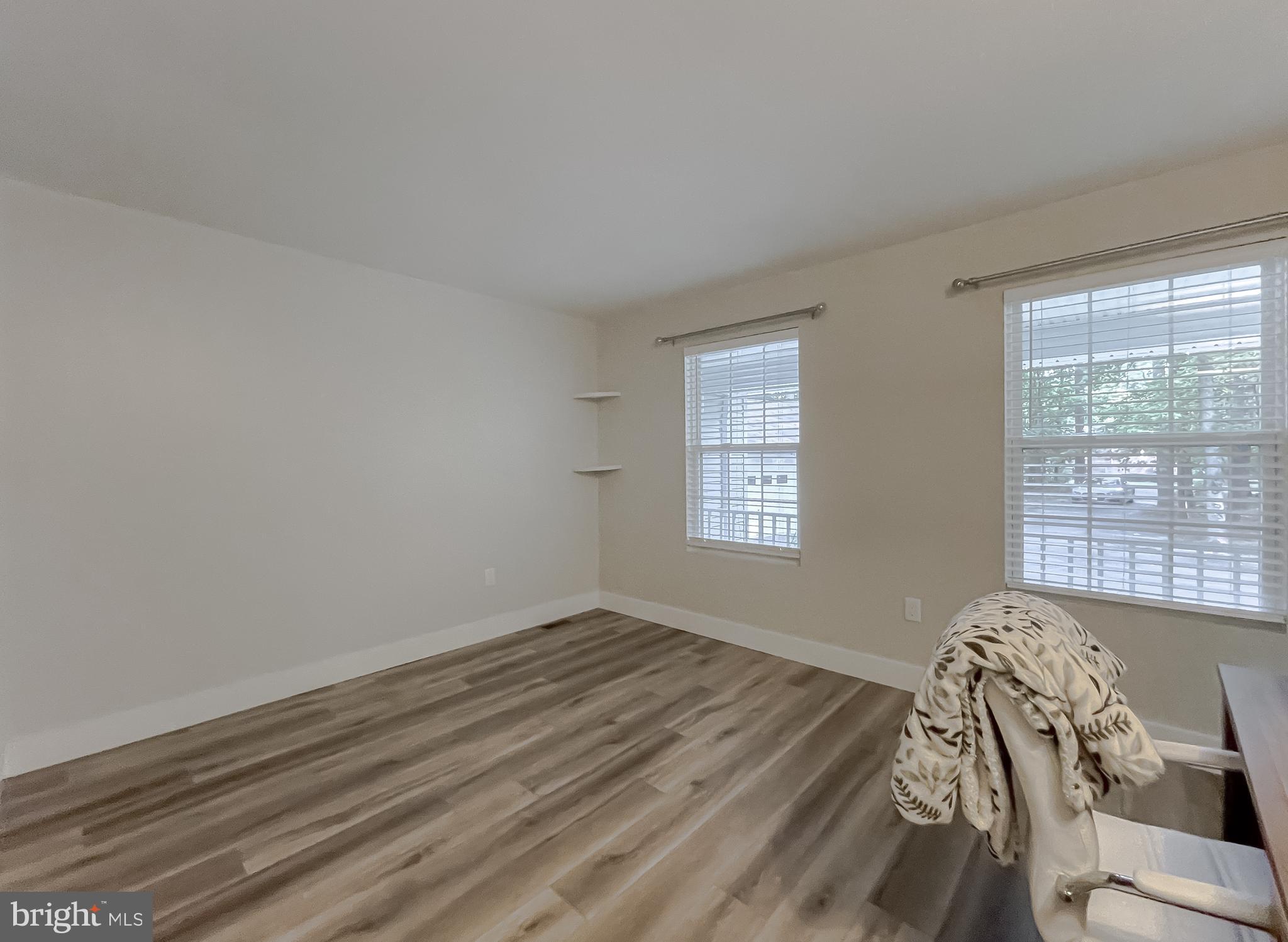 13630 Dowell Road Solomons, MD 20657 - Photo 21 of 121 a view of a room with wooden floor and windows