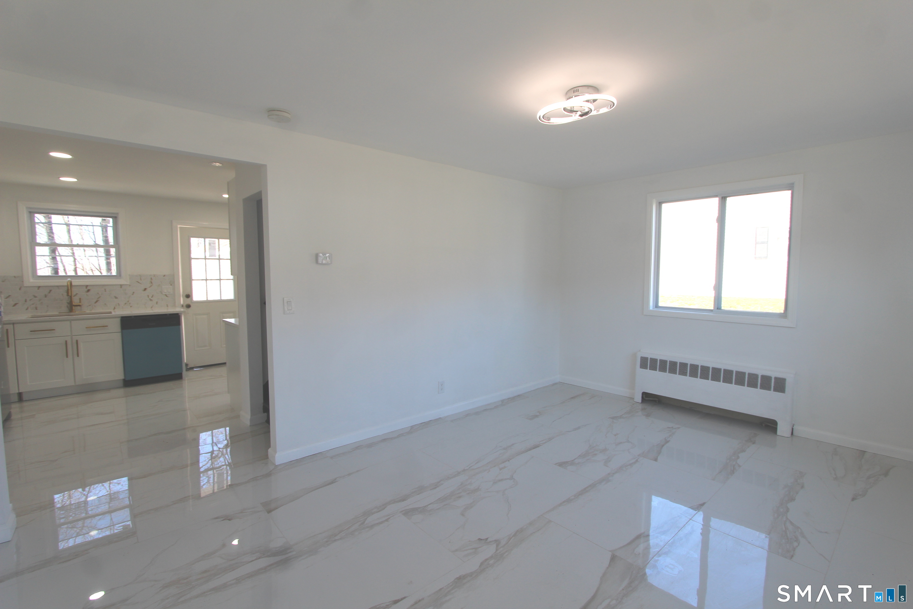 52 Glen Haven Road New Haven, CT 06513 - Photo 2 of 15 wooden floor in an empty room with a window