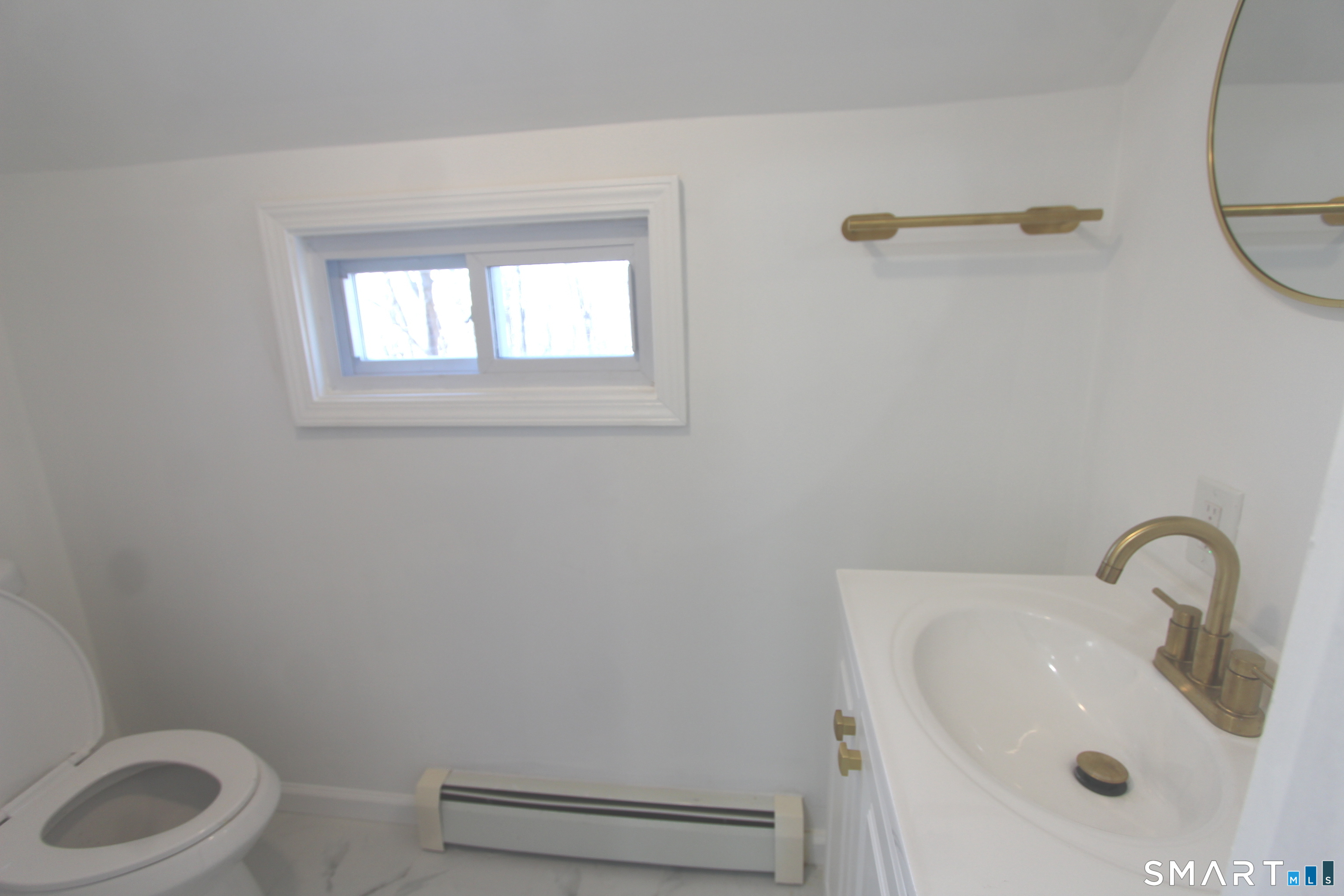 52 Glen Haven Road New Haven, CT 06513 - Photo 4 of 15 a bathroom with a sink and a toilet