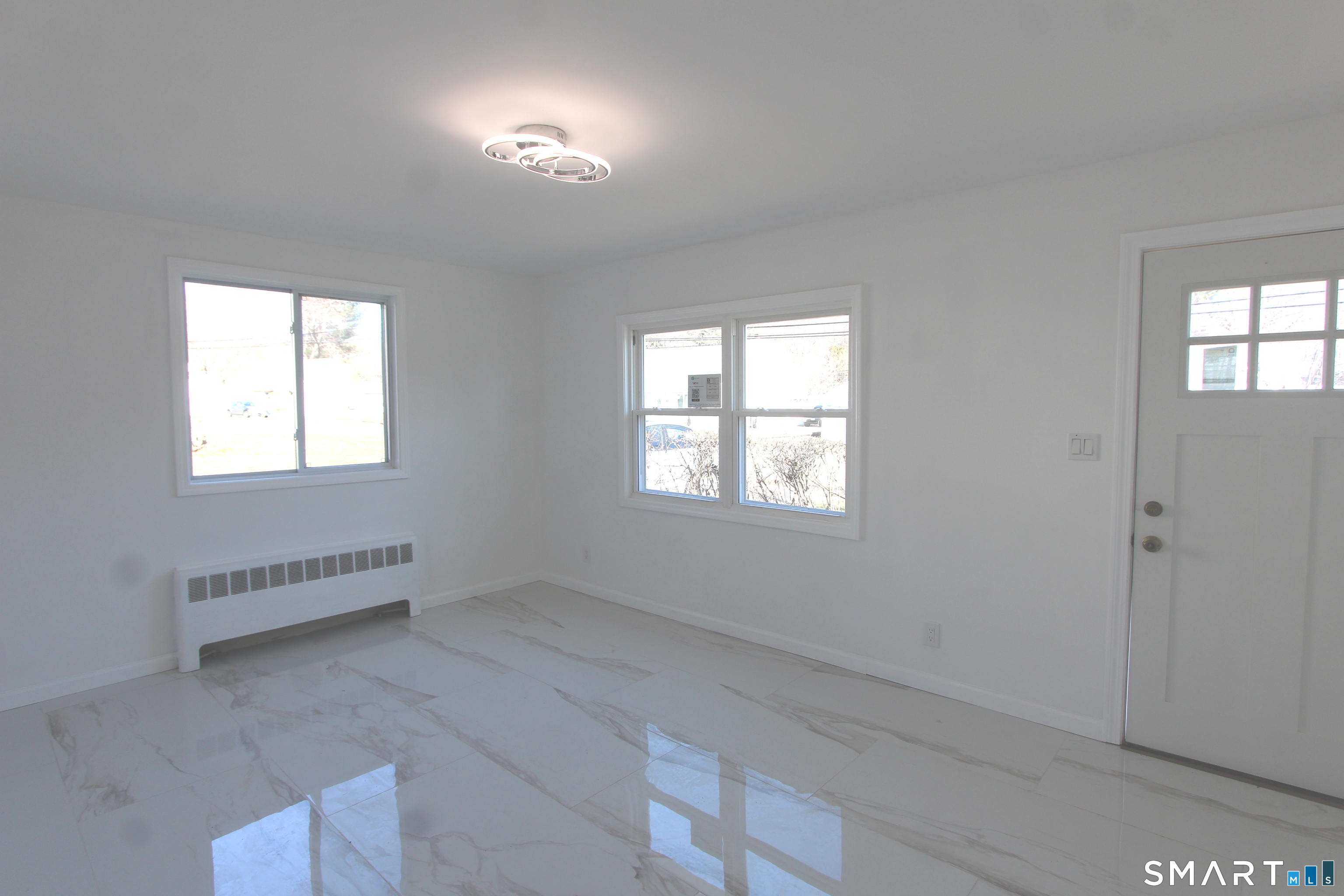 52 Glen Haven Road New Haven, CT 06513 - Photo 9 of 15 an empty room with windows