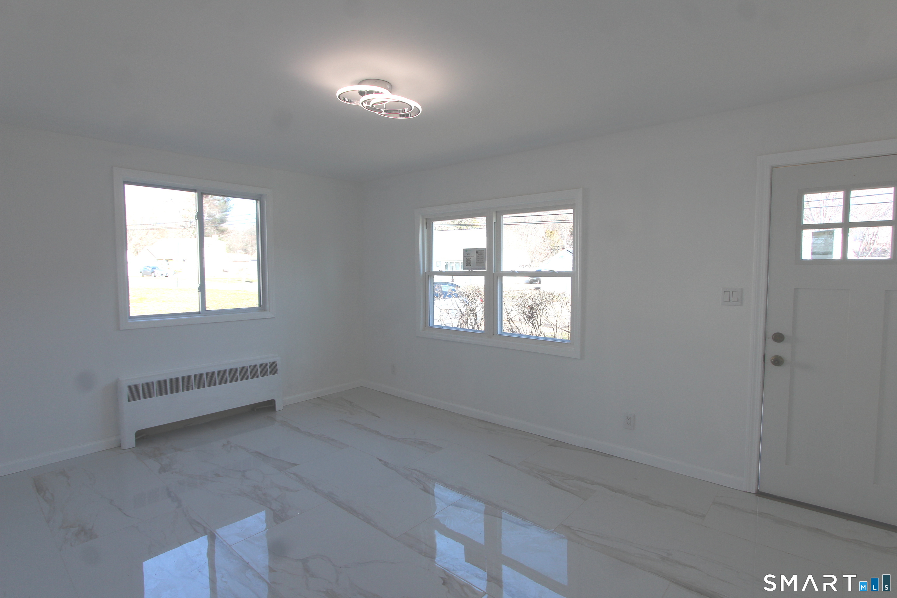 52 Glen Haven Road New Haven, CT 06513 - Photo 10 of 15 an empty room with windows