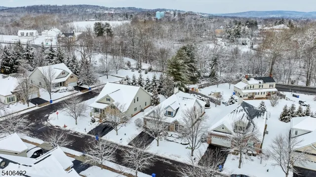 an aerial view of a house with outdoor space