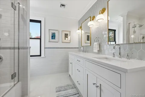 a spacious bathroom with a double vanity sink mirror and