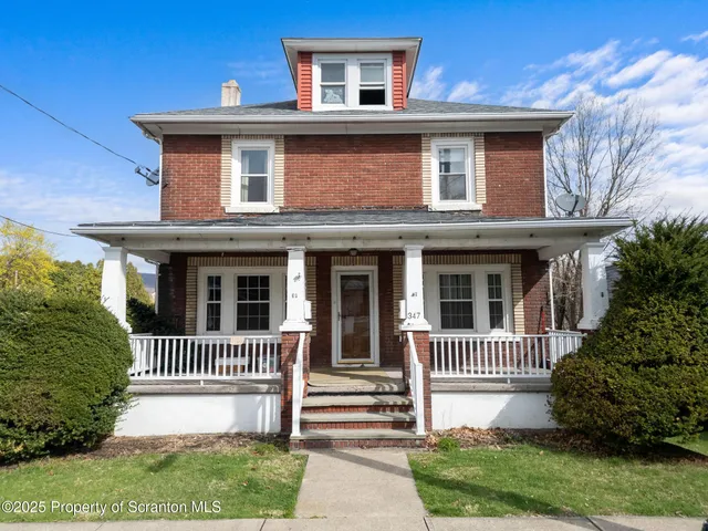 a front view of a house with a porch