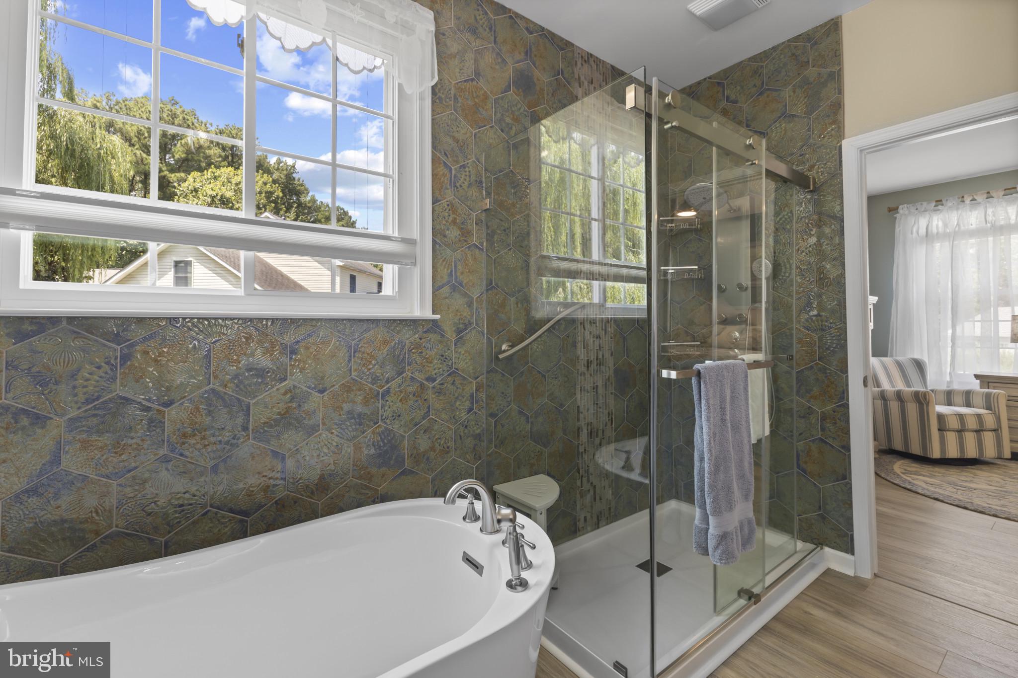 104 Woods Road Chester, MD 21619 - Photo 20 of 38 a bathroom with a bathtub and a shower