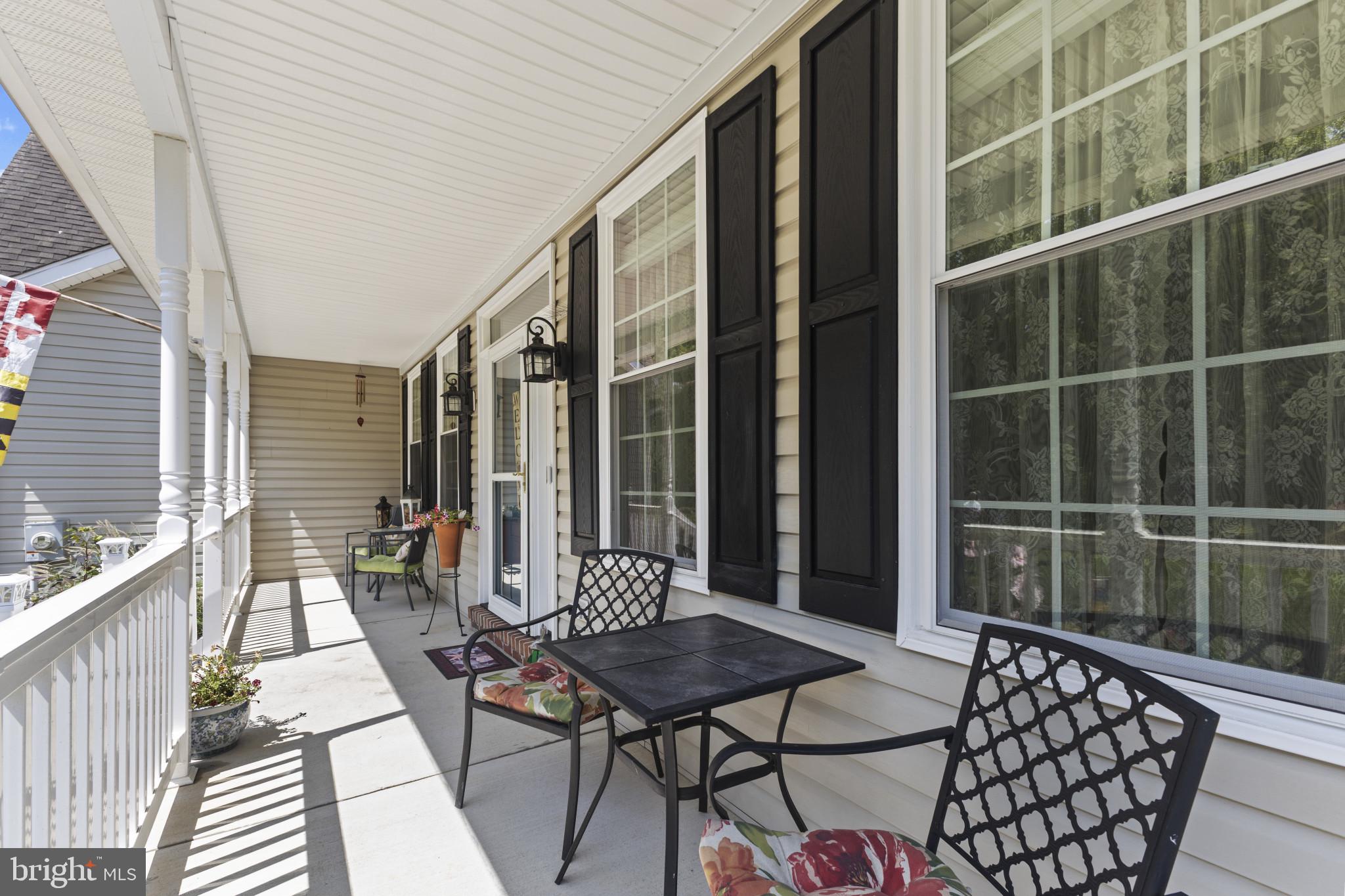 104 Woods Road Chester, MD 21619 - Photo 34 of 38 a balcony with furniture and wooden floor