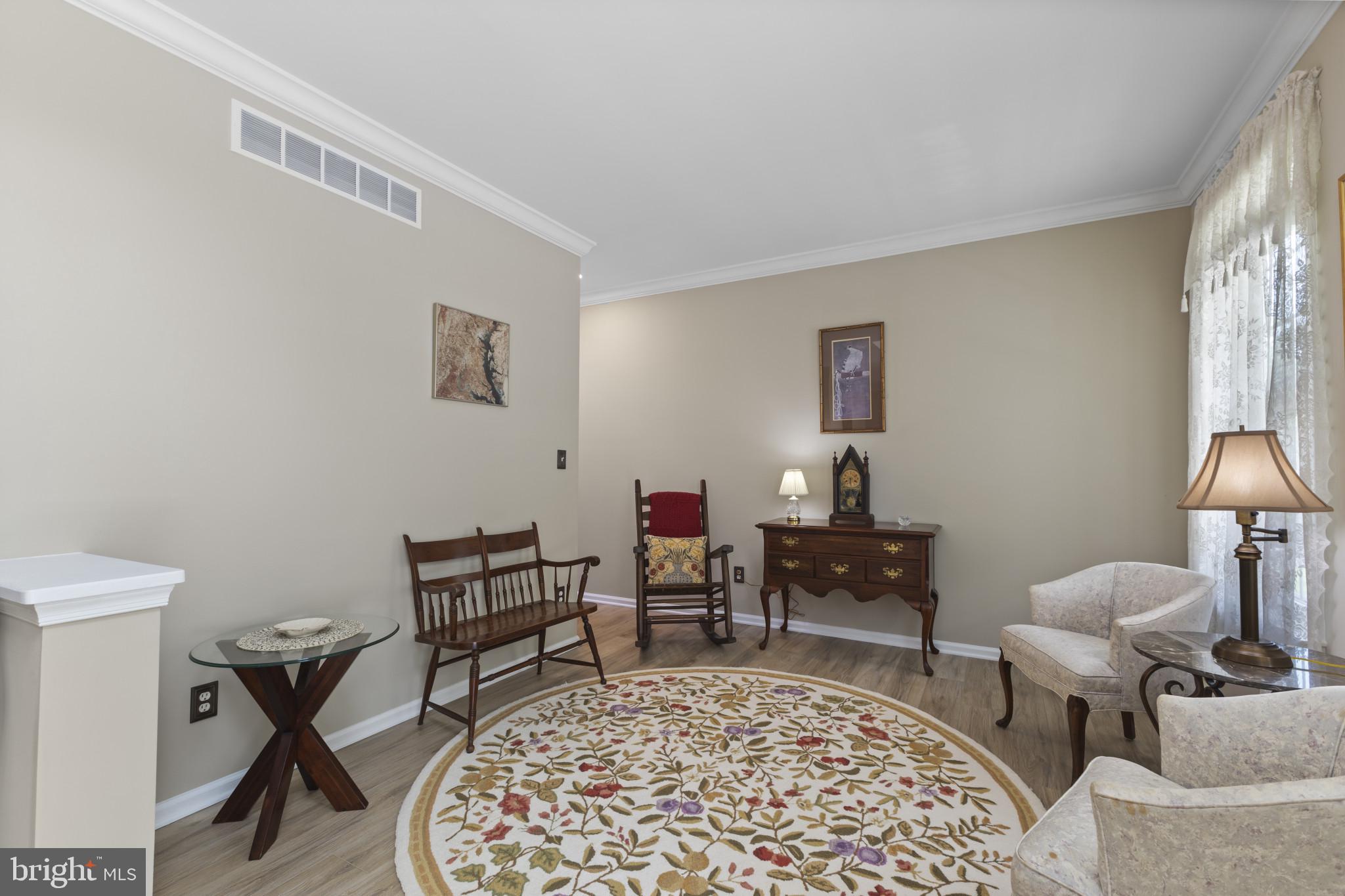 104 Woods Road Chester, MD 21619 - Photo 5 of 38 a living room with furniture and a lamp