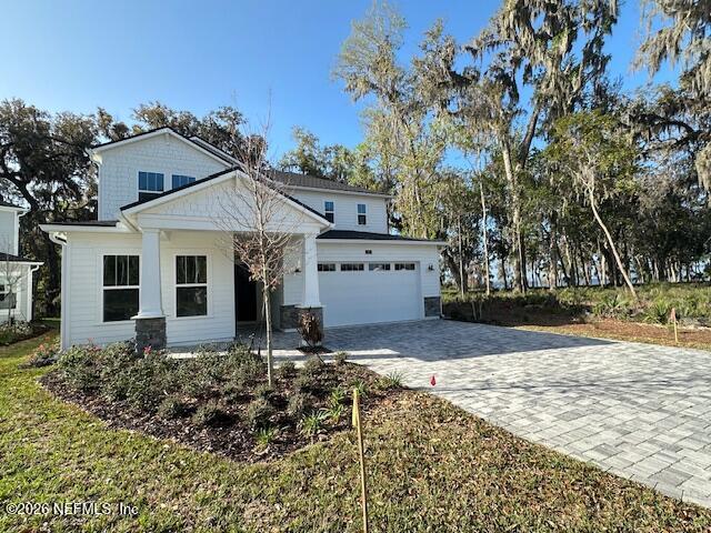 62 Slip Cove St. Johns, FL 32259 - Photo 1 of 54 a front view of a house with garden