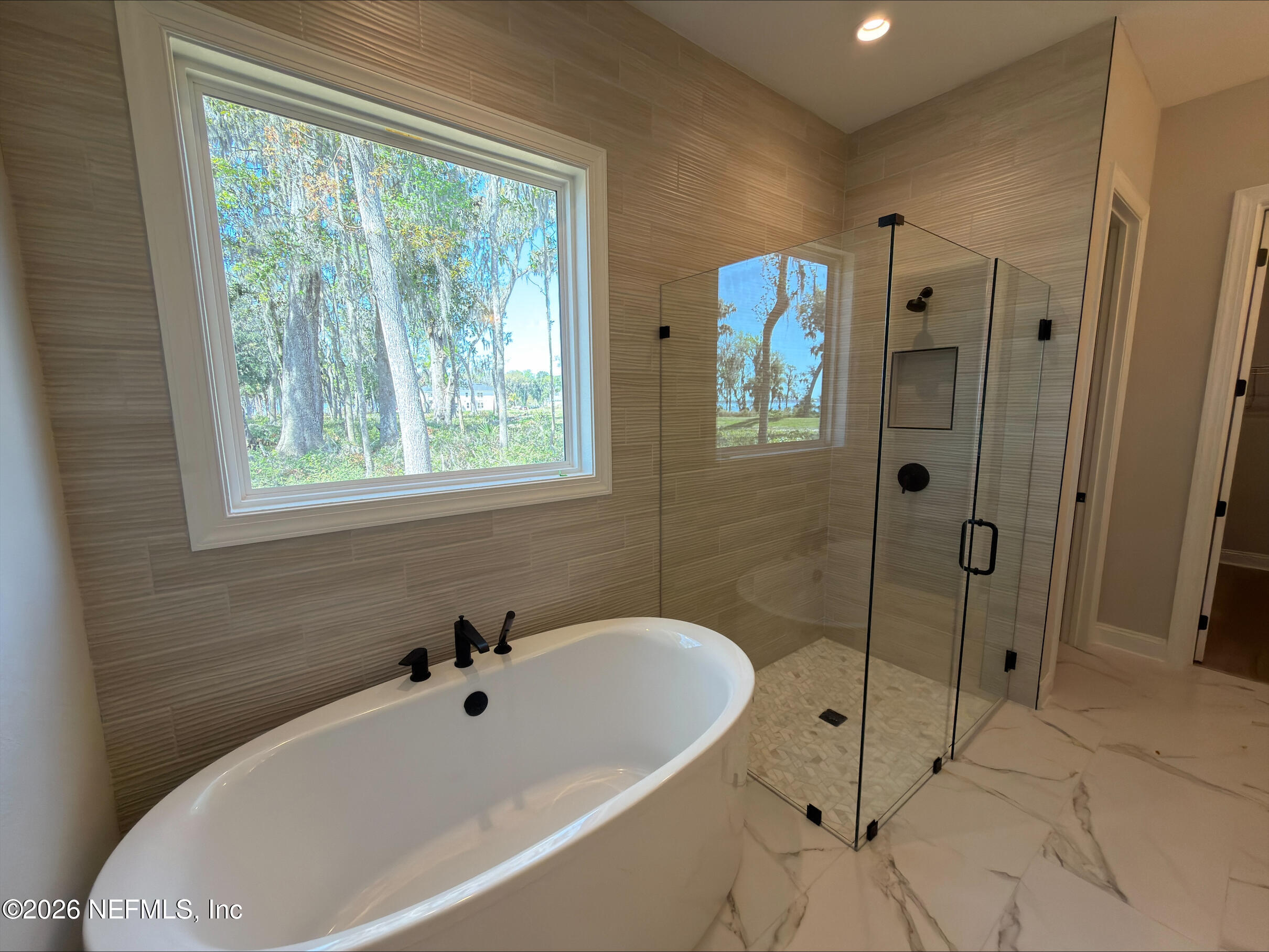 62 Slip Cove St. Johns, FL 32259 - Photo 18 of 54 a white bath tub sitting next to a shower