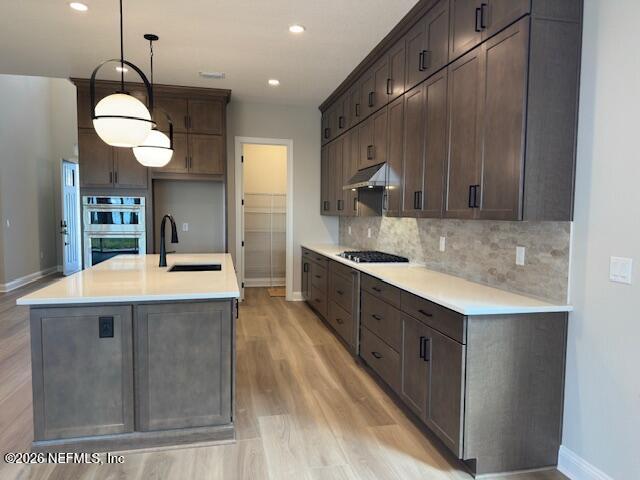 62 Slip Cove St. Johns, FL 32259 - Photo 24 of 54 a kitchen with kitchen island a sink stainless steel appliances and cabinets
