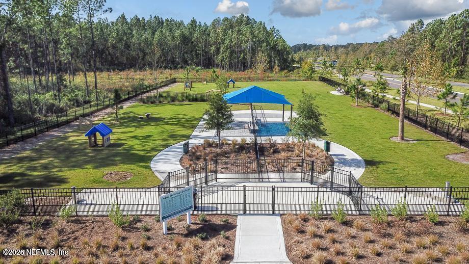62 Slip Cove St. Johns, FL 32259 - Photo 33 of 54 a view of a swimming pool with a yard and sitting area