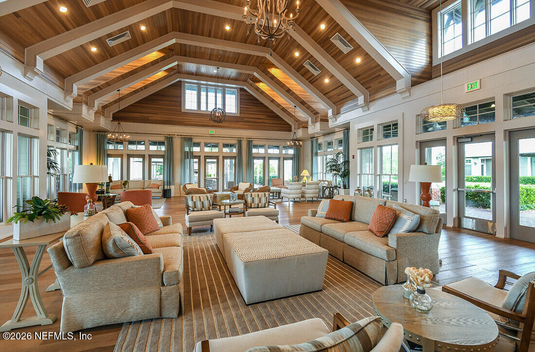 62 Slip Cove St. Johns, FL 32259 - Photo 35 of 54 a living room with furniture and a chandelier