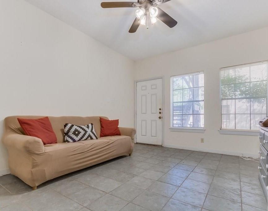 2216 San Gabriel Street, Unit 107 Austin, TX 78705 - Photo 6 of 7 a living room with furniture and windows