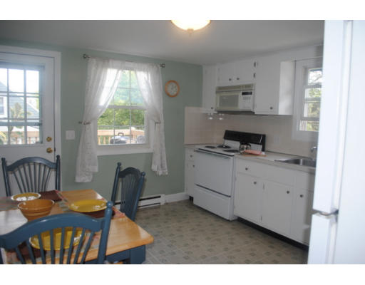 35 Argyle Road, Unit 35 Arlington, MA 02476 - Photo 6 of 12 a living room with furniture a window and a fireplace