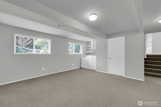 a view of an empty room with a window