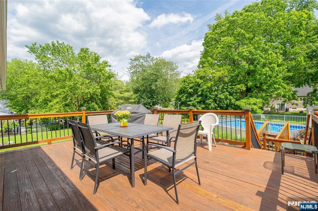 55 Marcia Road Ringwood, NJ 07456 - Photo 29 of 42 a patio with hardwood table and chairs