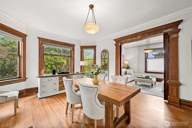 a view of a dining room with furniture window and wooden floor
