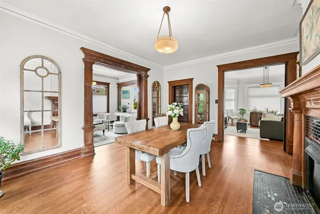 a view of a dining room with furniture wooden floor and a chandelier