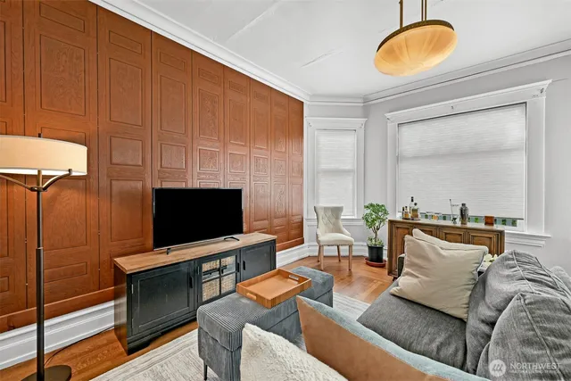 a living room with furniture and a flat screen tv