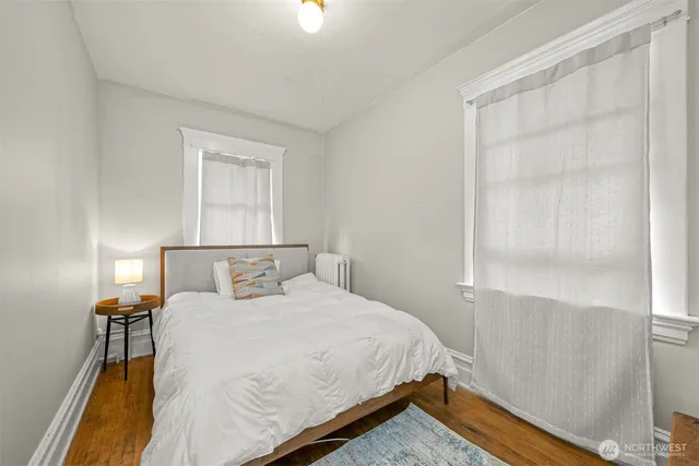 a bed room with a bed and a night stand