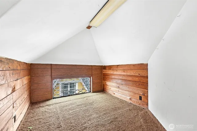 a view of an empty room and fire place