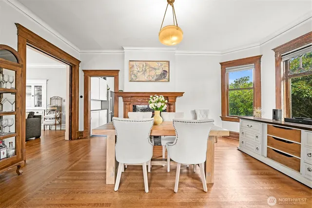 a view of a dining room with furniture and wooden floor