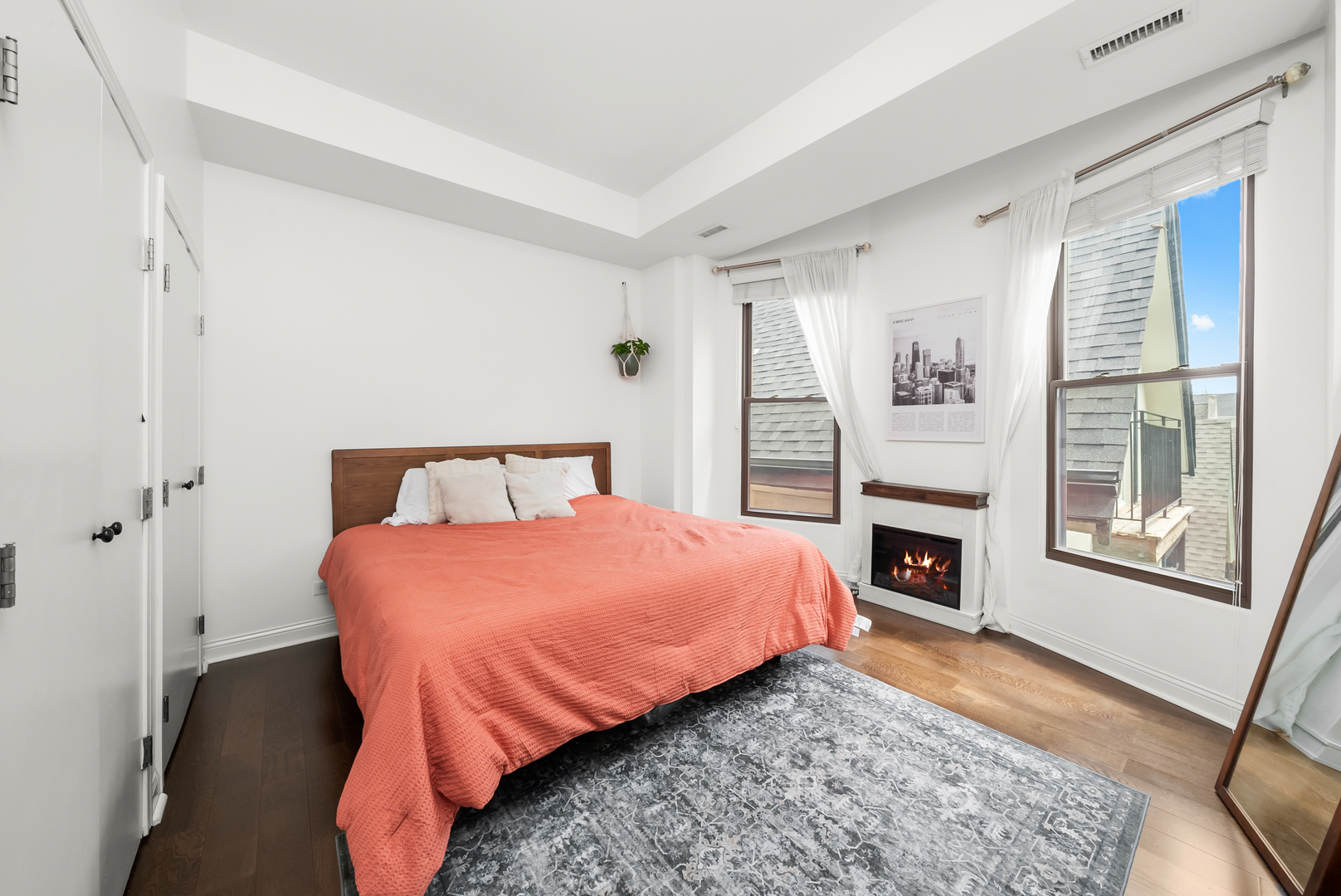 3055 North Seminary Avenue, Unit 3S Chicago, IL 60657 - Photo 12 of 23 a spacious bedroom with a bed and a fireplace