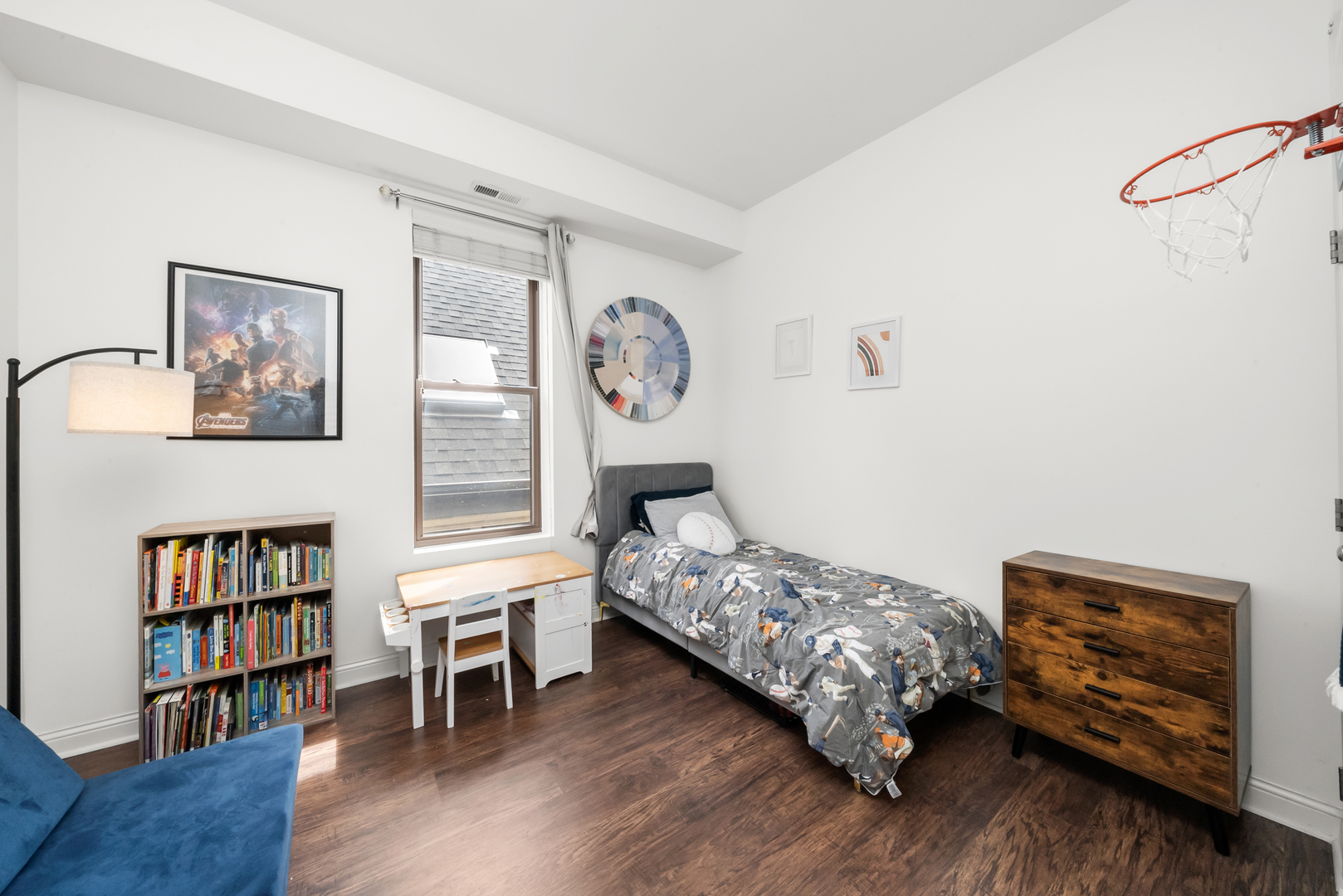 3055 North Seminary Avenue, Unit 3S Chicago, IL 60657 - Photo 16 of 23 a bedroom with furniture and a book shelf