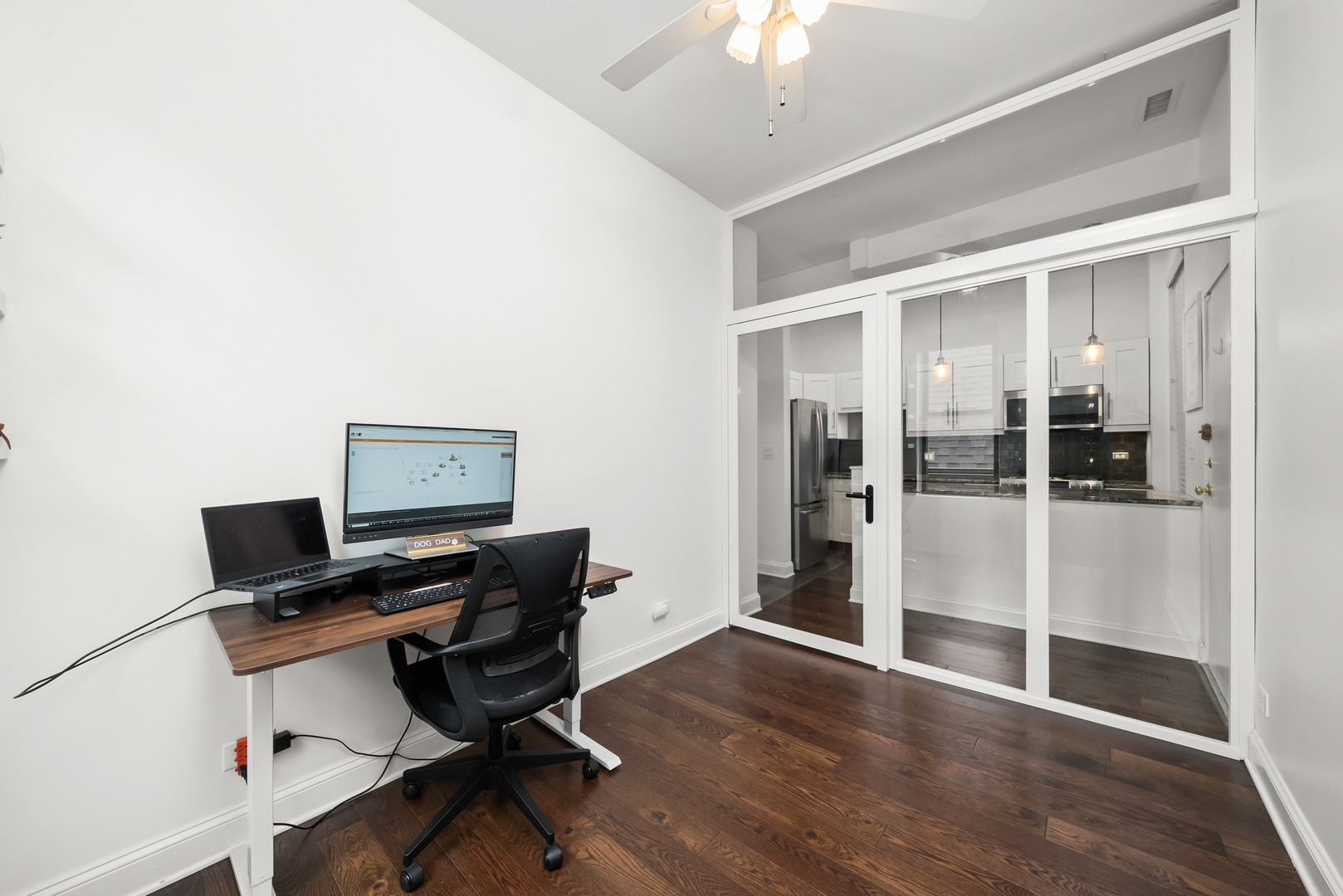 3055 North Seminary Avenue, Unit 3S Chicago, IL 60657 - Photo 17 of 23 a view of a workspace with furniture and wooden floor