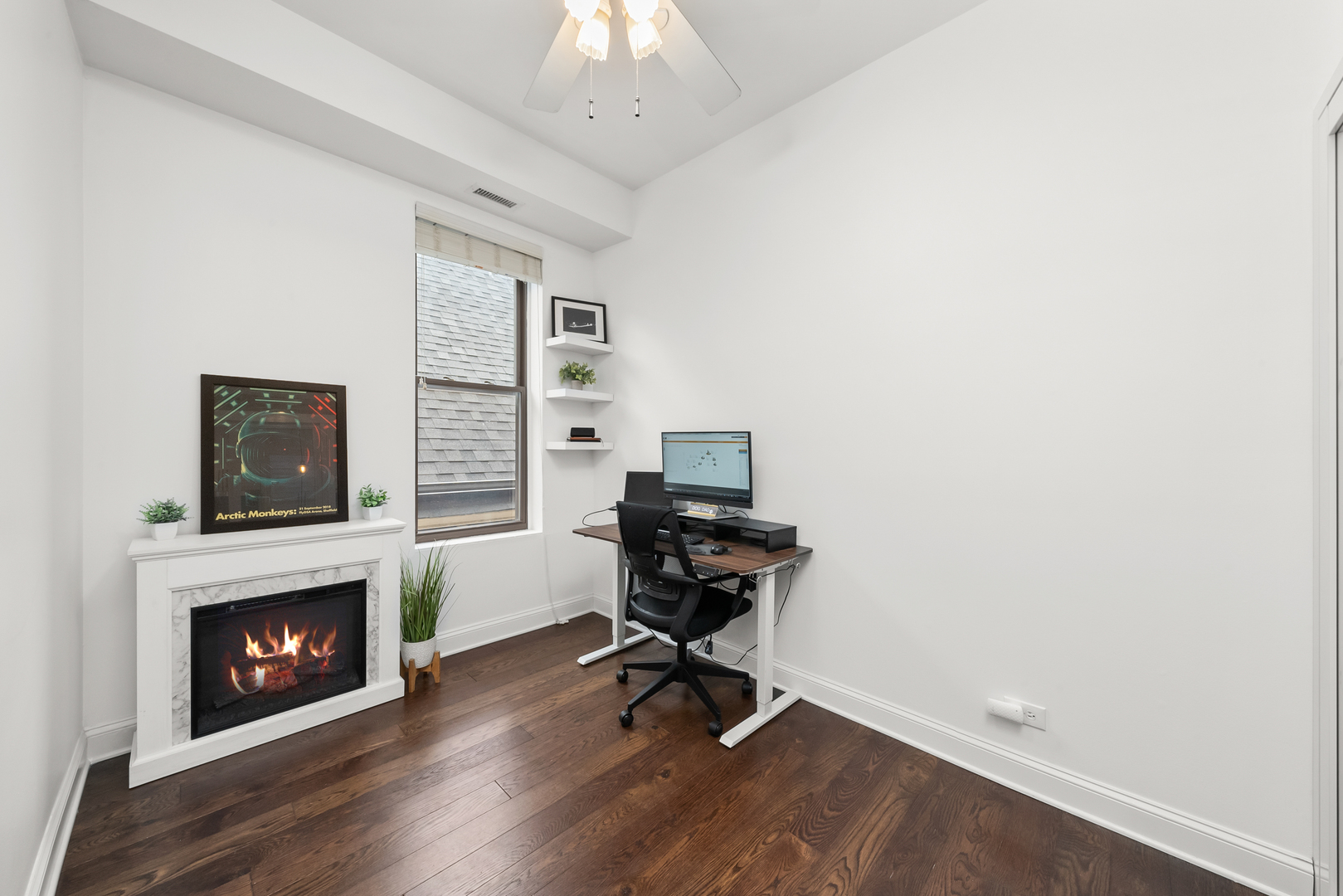 3055 North Seminary Avenue, Unit 3S Chicago, IL 60657 - Photo 18 of 23 a workspace with furniture and a fireplace