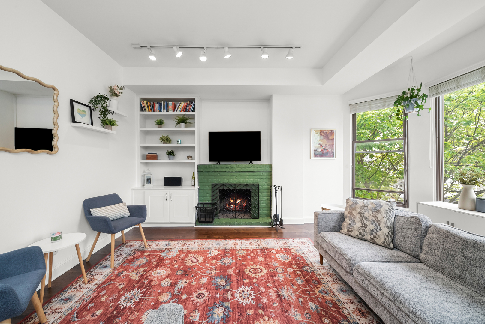 3055 North Seminary Avenue, Unit 3S Chicago, IL 60657 - Photo 3 of 23 a living room with furniture a flat screen tv and a fireplace