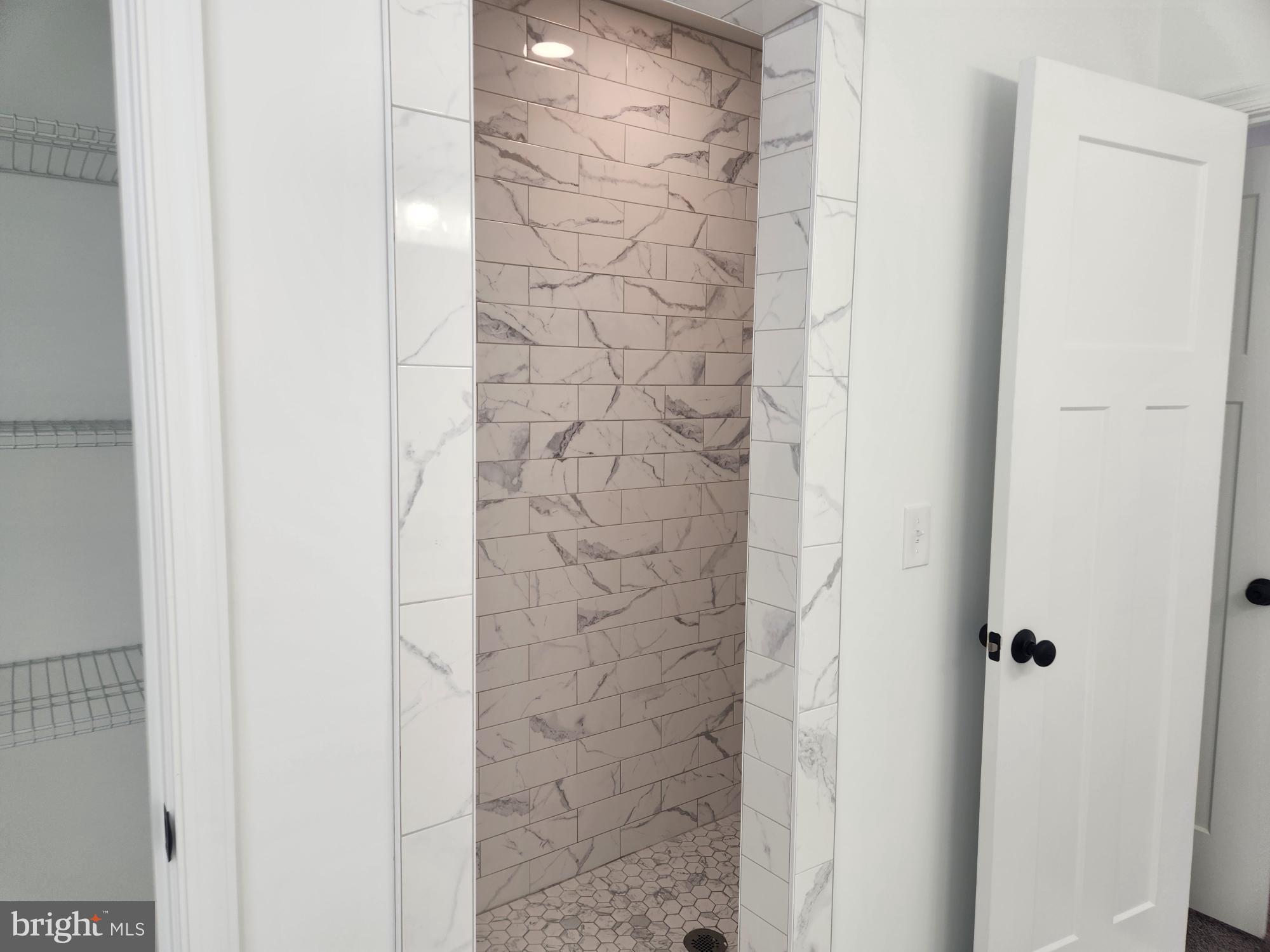 1929 Dunkleberger Road Elliottsburg, PA 17024 - Photo 24 of 48 Elegant tiled shower with modern design.