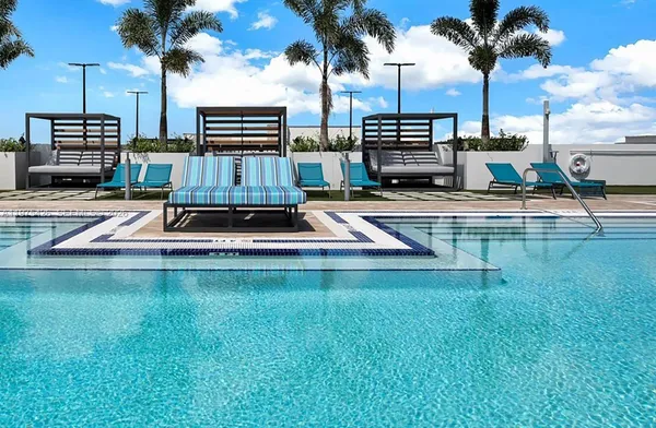a view of a swimming pool with a table and chairs