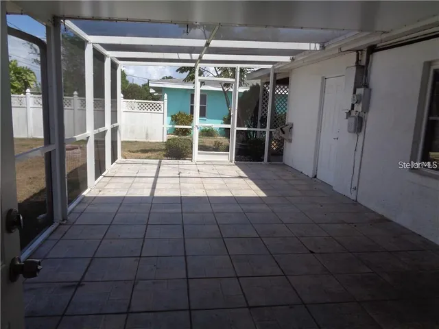 a view of empty room with windows