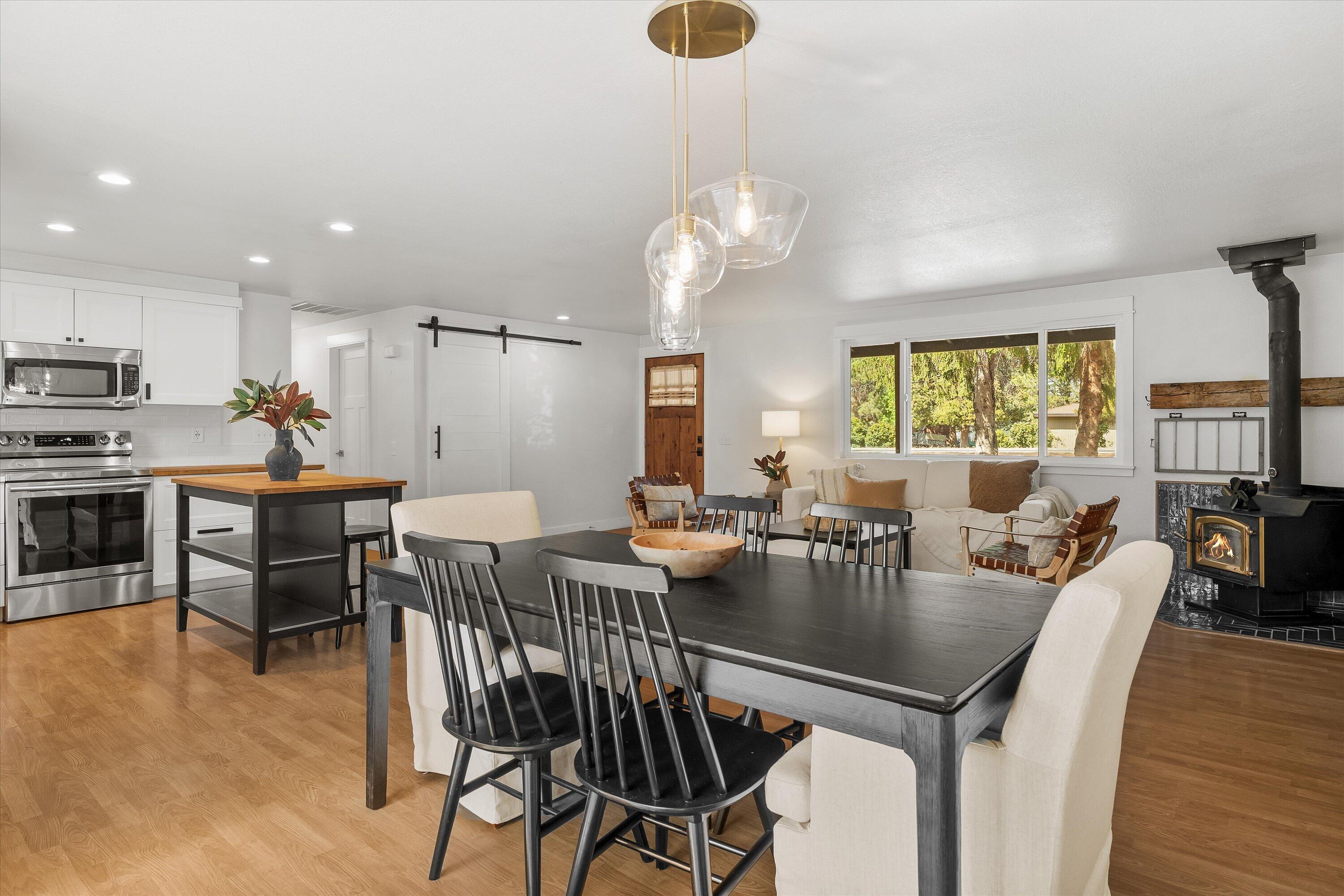 63634 Hunters Circle Bend, OR 97701 - Photo 6 of 28 a view of a dining room with furniture window and wooden floor