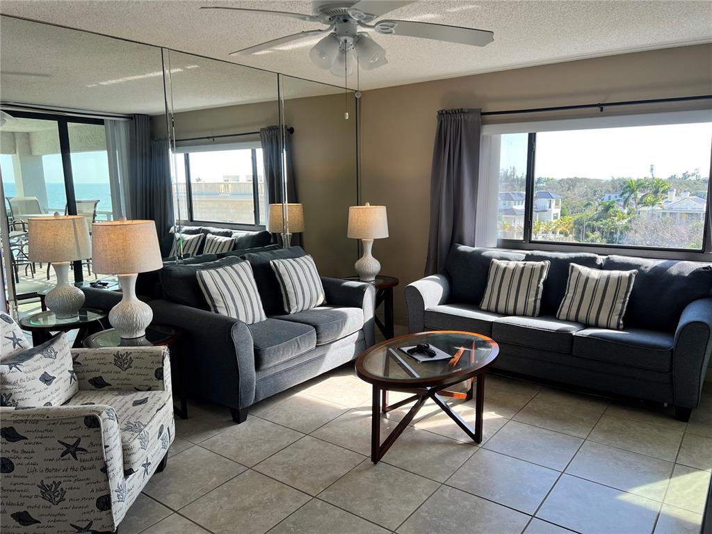 1001 Point Of Rocks Road, Unit 608 Sarasota, FL 34242 - Photo 2 of 33 a living room with furniture and a large window