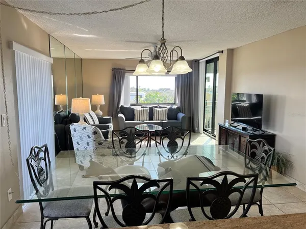 a view of a dining room with furniture window and outside view