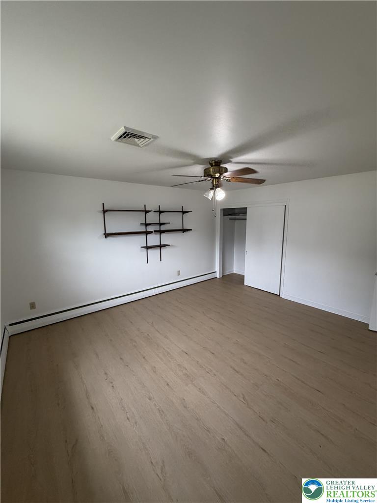 5391 Chapmans Road, Unit 2 Orefield, PA 18069 - Photo 20 of 22 A well-proportioned bedroom with ample natural light and durable wood-look flooring.