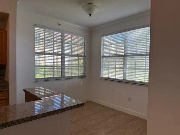 a kitchen with stainless steel appliances granite countertop a sink and a stove