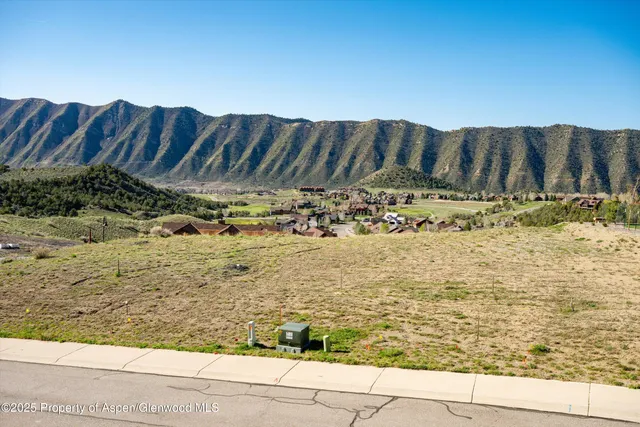 a view of a backyard of the house