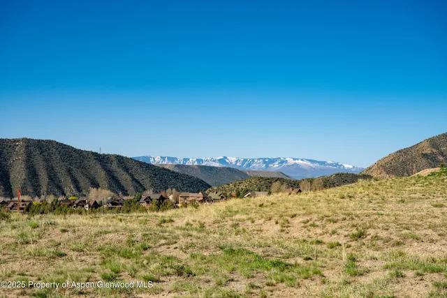 a view of a large body of water with a building in the background