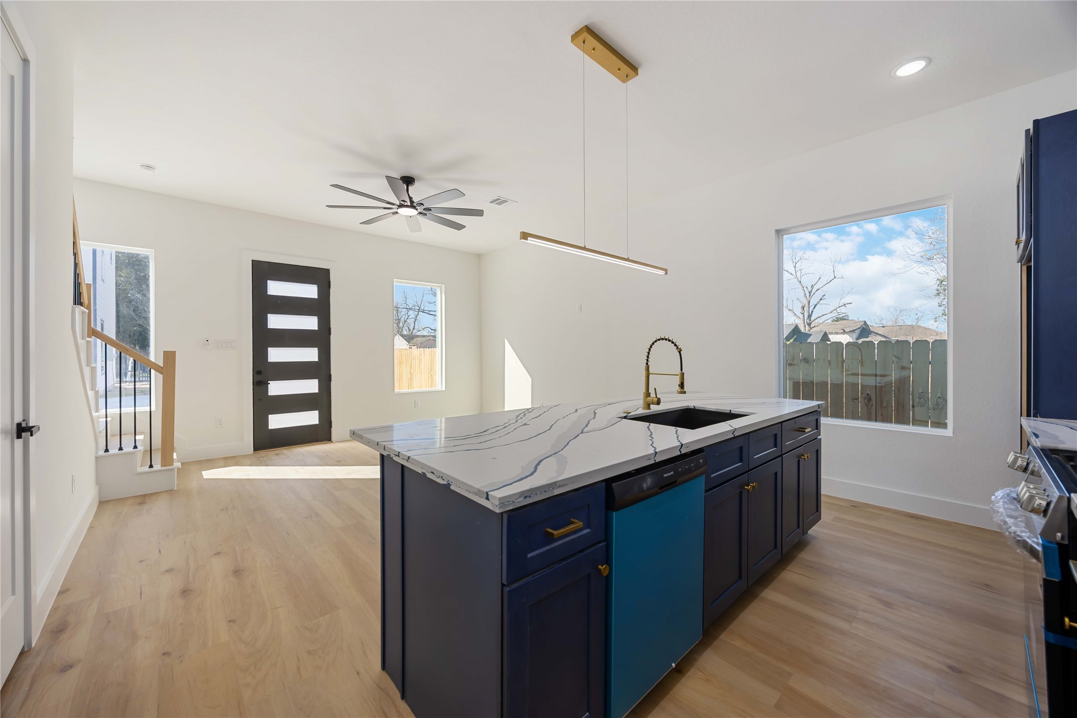 4533 Bricker Street Houston, TX 77051 - Photo 11 of 21 a kitchen with stainless steel appliances granite countertop a sink a stove and a wooden floors